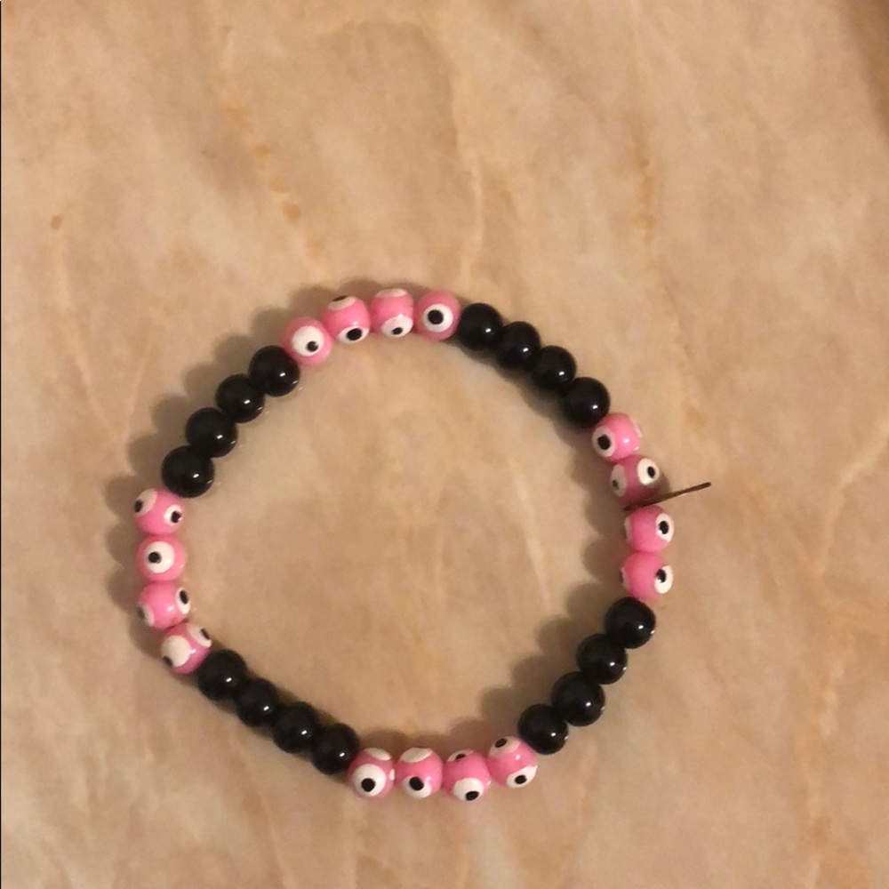 Evil eye bracelet with a heart charm